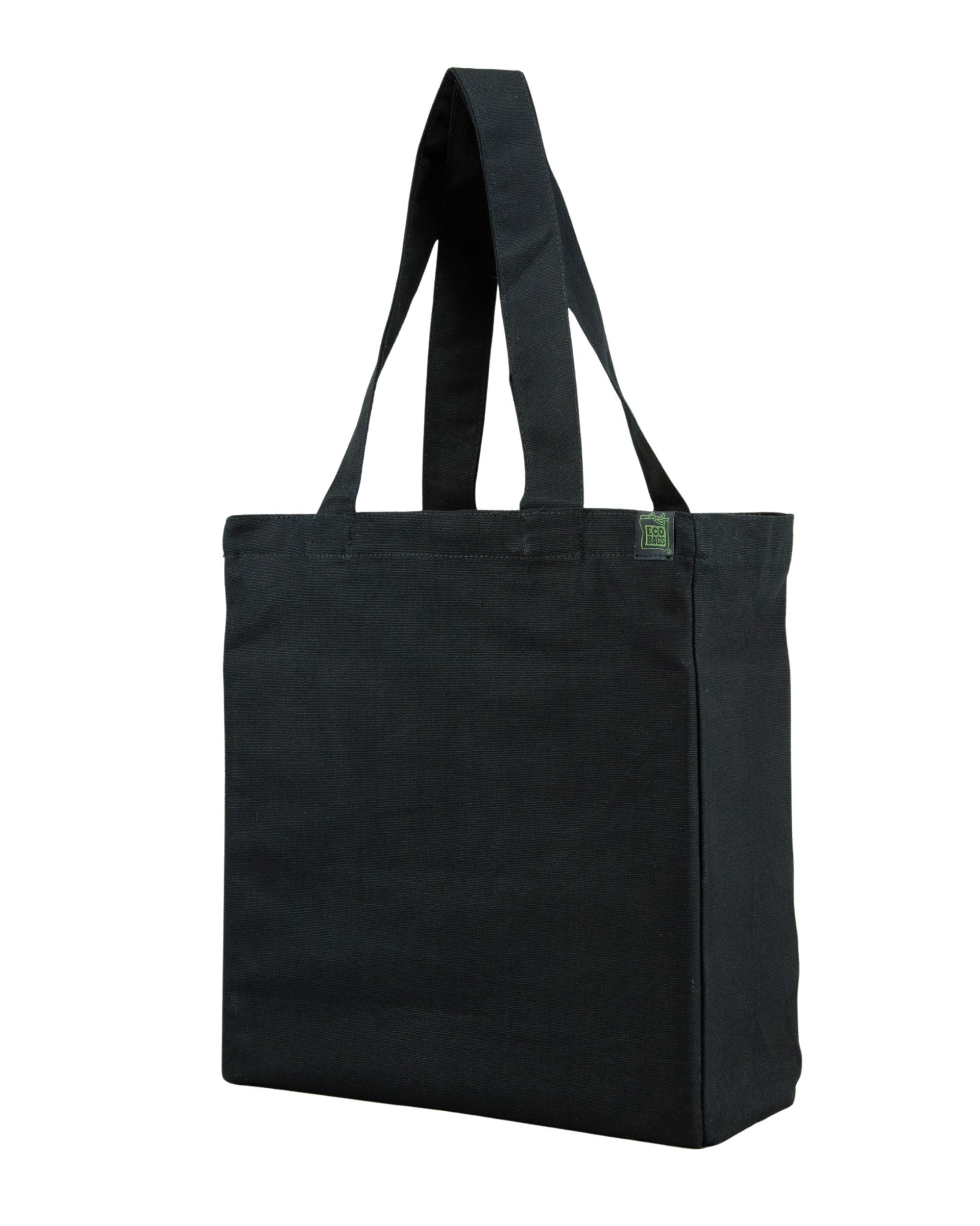 Black tote bag with a side and bottom gusset with a small green label on a white background