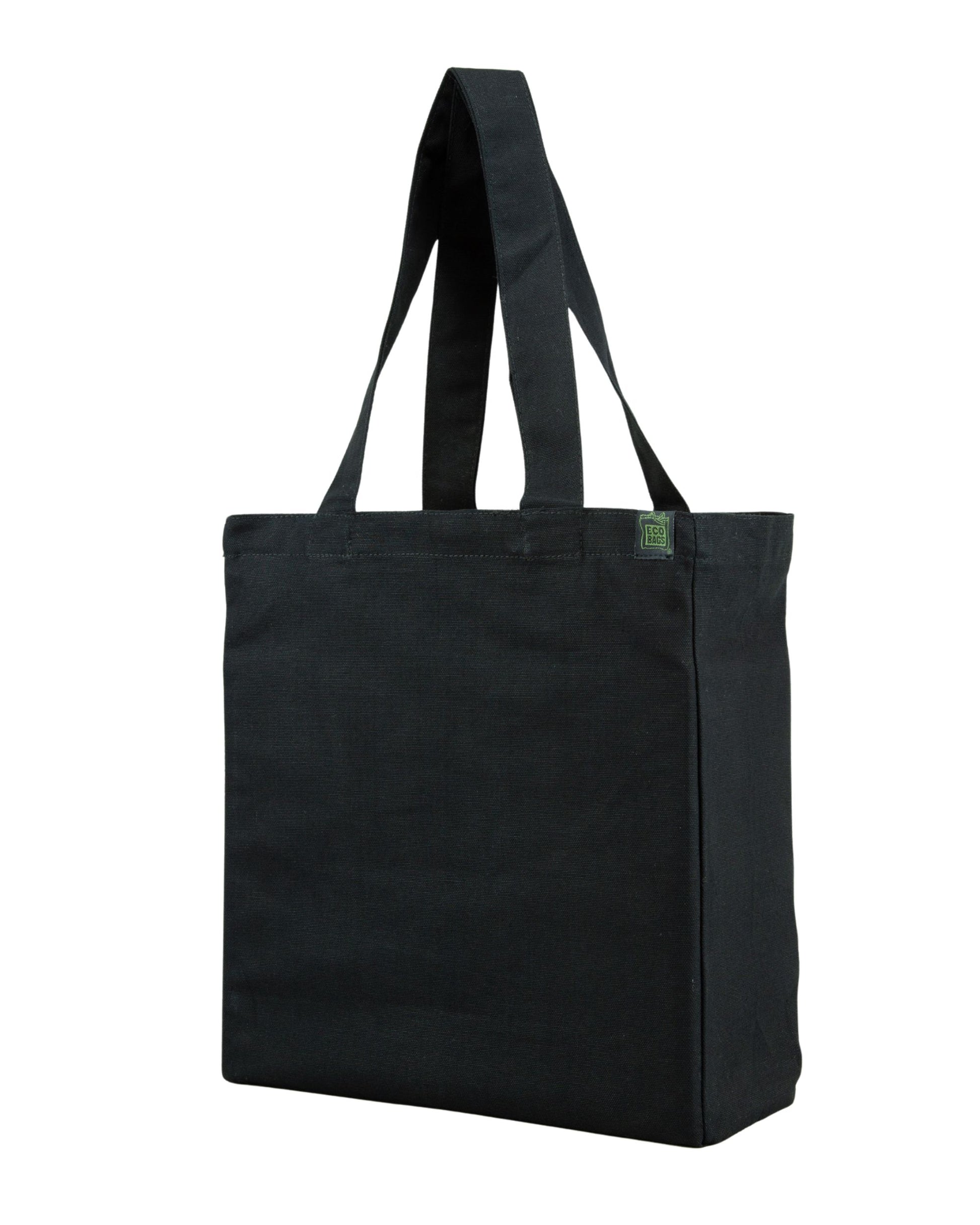 Black tote bag with a side and bottom gusset with a small green label on a white background