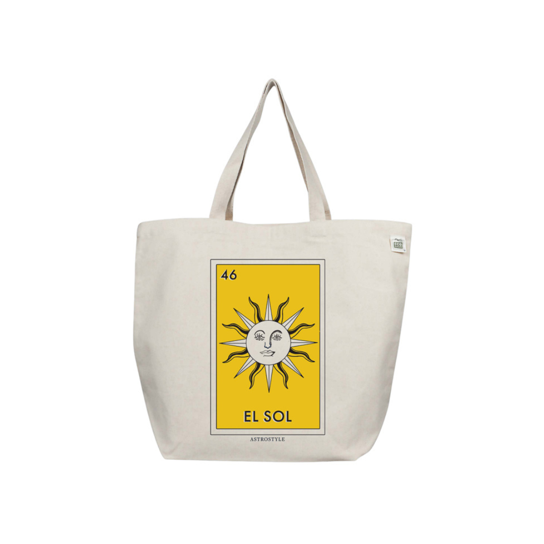 A natural cotton tote bag with a yellow pocket and a graphic print of a sun face on the front, with the text 'EL SOL'.